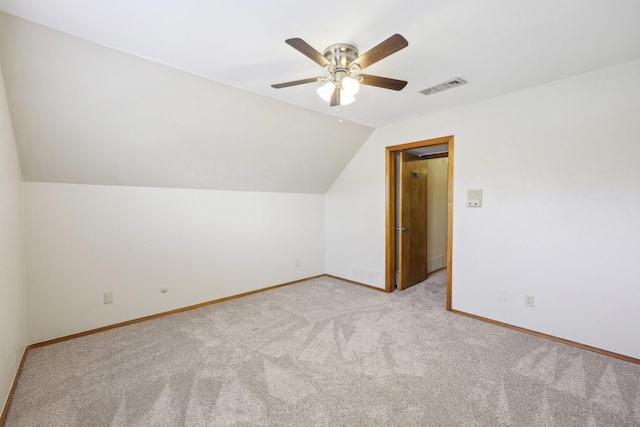 bonus room with ceiling fan, light carpet, and vaulted ceiling