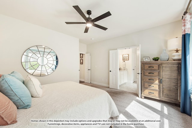 bedroom featuring light carpet, ensuite bathroom, and ceiling fan