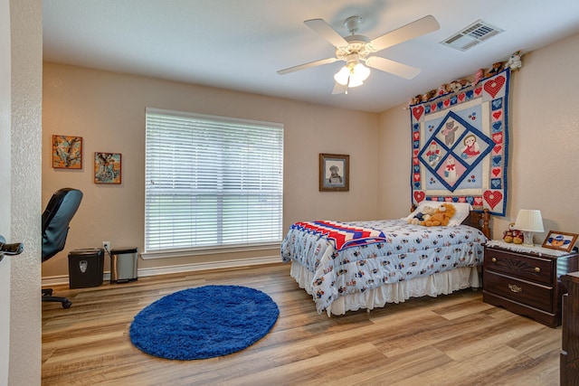 bedroom featuring light hardwood / wood-style floors and ceiling fan