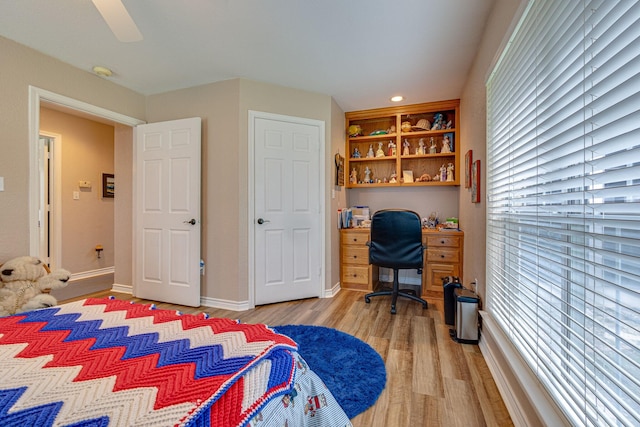 bedroom with ceiling fan and light hardwood / wood-style floors