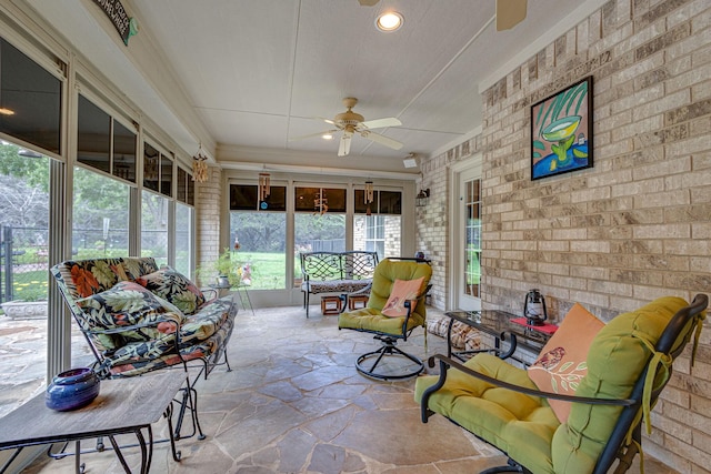 sunroom with ceiling fan