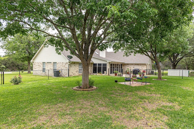 view of yard with central AC and a patio area