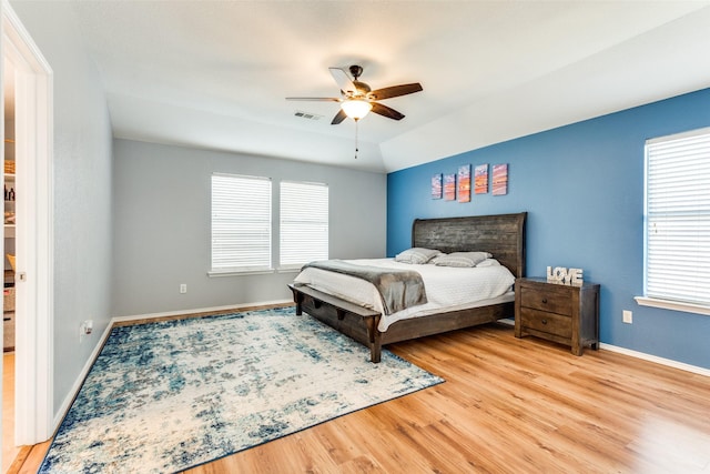 bedroom with ceiling fan and light wood-type flooring