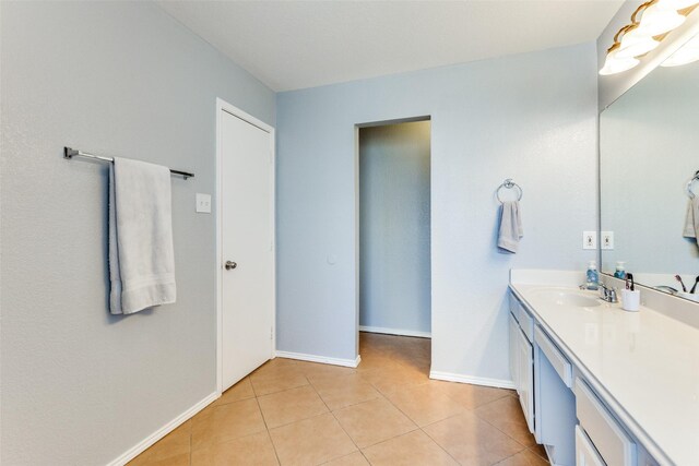 bathroom featuring tile patterned flooring and vanity