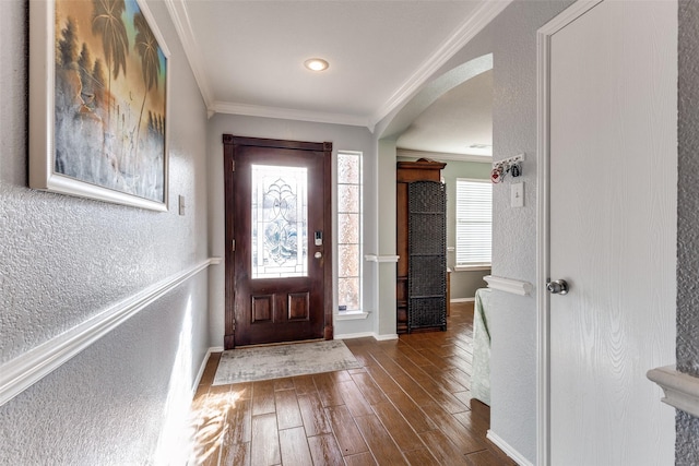 foyer featuring ornamental molding