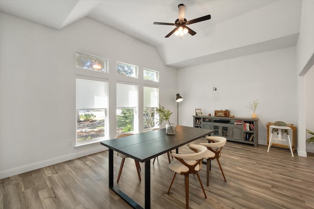 dining space with lofted ceiling, hardwood / wood-style floors, and ceiling fan