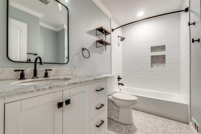 full bathroom featuring vanity, crown molding, tile patterned flooring, tiled shower / bath combo, and toilet