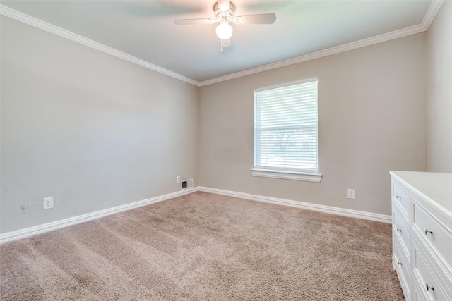 unfurnished room featuring ceiling fan, crown molding, and light carpet