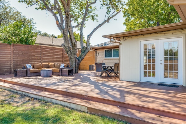 wooden deck with french doors, an outdoor living space, and cooling unit