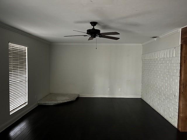 unfurnished room with ornamental molding, dark hardwood / wood-style flooring, and ceiling fan