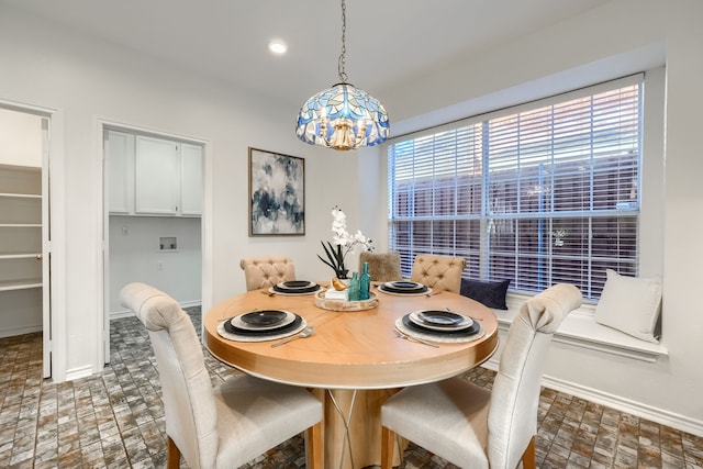 dining room with plenty of natural light and a chandelier