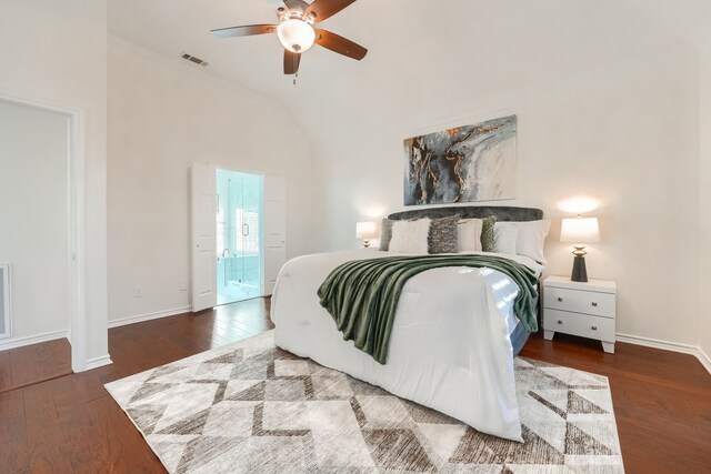 bedroom featuring vaulted ceiling, connected bathroom, ceiling fan, and dark hardwood / wood-style floors