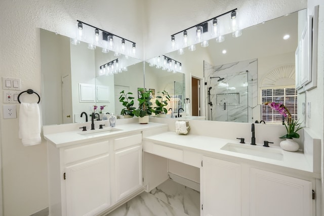 bathroom with vanity and a shower with shower door