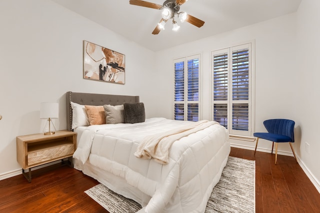 bedroom with ceiling fan and dark hardwood / wood-style floors