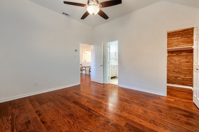 spare room featuring hardwood / wood-style flooring, ceiling fan, and lofted ceiling