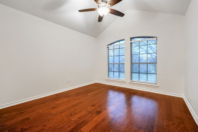 spare room featuring wood-type flooring, ceiling fan, and lofted ceiling