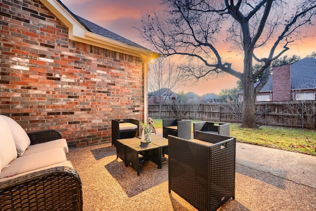 view of patio terrace at dusk