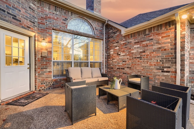 patio terrace at dusk with an outdoor hangout area