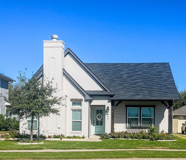 view of front of property with a front lawn