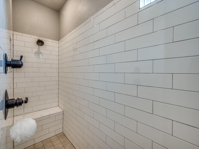 bathroom featuring a tile shower