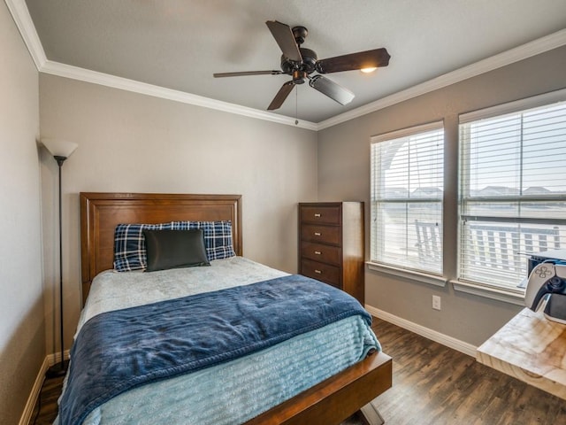 bedroom with dark hardwood / wood-style flooring, ceiling fan, and crown molding