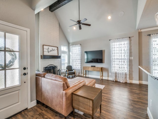 living room with a wealth of natural light, high vaulted ceiling, and ceiling fan