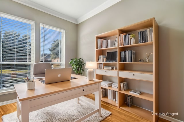 office space featuring crown molding and light wood-type flooring