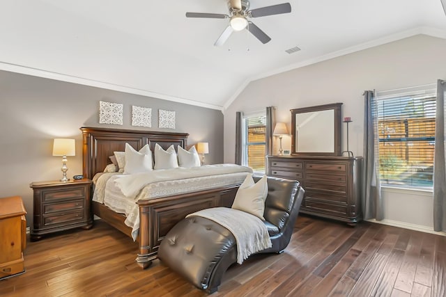 bedroom featuring ornamental molding, vaulted ceiling, ceiling fan, and dark wood-type flooring