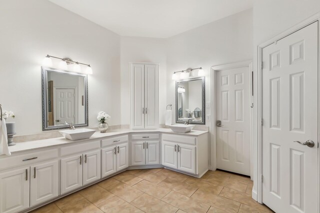 bathroom with tile patterned flooring and vanity