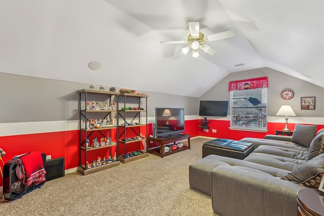 carpeted cinema with ceiling fan and lofted ceiling