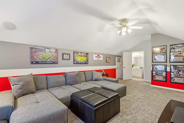 carpeted living room featuring ceiling fan and lofted ceiling