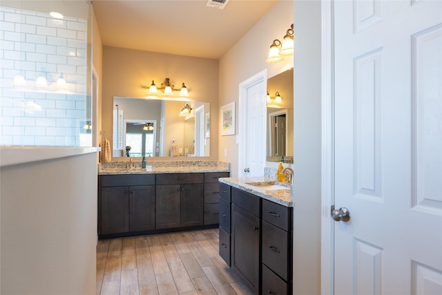 bathroom featuring vanity and wood-type flooring