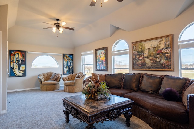 living room featuring ceiling fan, carpet floors, and vaulted ceiling