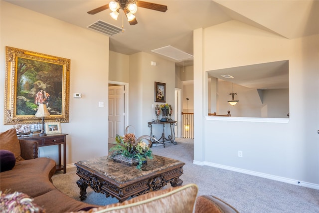 carpeted living room featuring vaulted ceiling and ceiling fan