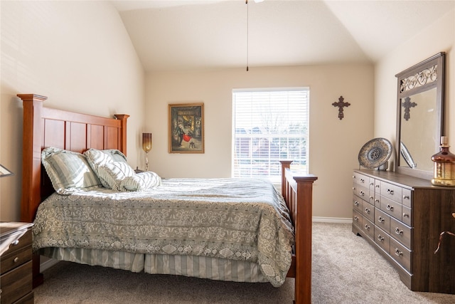 bedroom featuring light carpet and vaulted ceiling