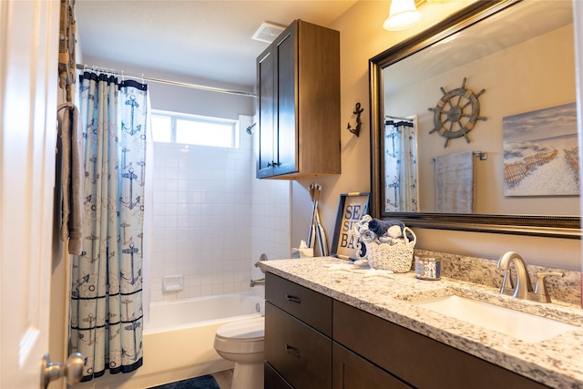 full bathroom with shower / bath combination with curtain, vanity, and toilet