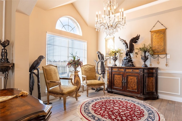 sitting room featuring light hardwood / wood-style flooring and vaulted ceiling