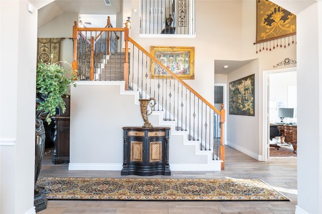 staircase with a towering ceiling