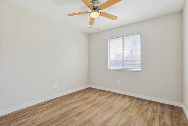 unfurnished room featuring ceiling fan and light hardwood / wood-style flooring