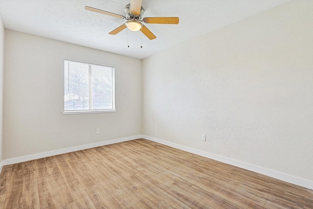 unfurnished room with ceiling fan and light hardwood / wood-style flooring