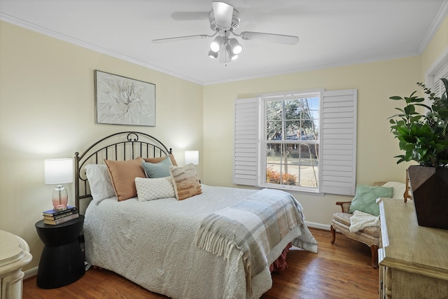 bedroom featuring crown molding, ceiling fan, and dark hardwood / wood-style flooring