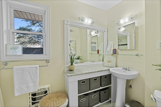 bathroom with sink and toilet