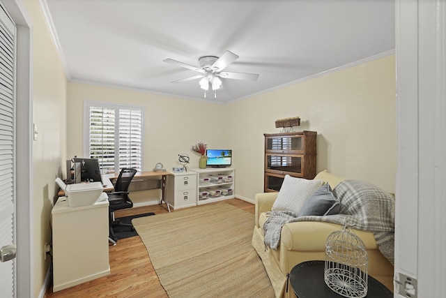 office space featuring crown molding, light hardwood / wood-style floors, and ceiling fan