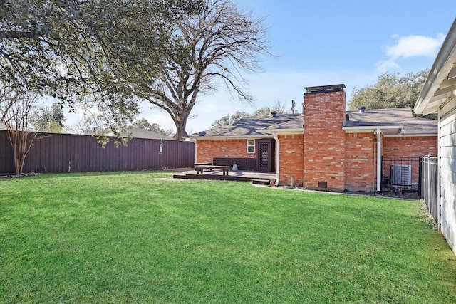 view of yard featuring central air condition unit and a patio area