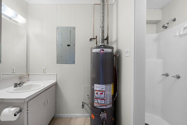 bathroom with walk in shower, water heater, tile patterned floors, electric panel, and vanity