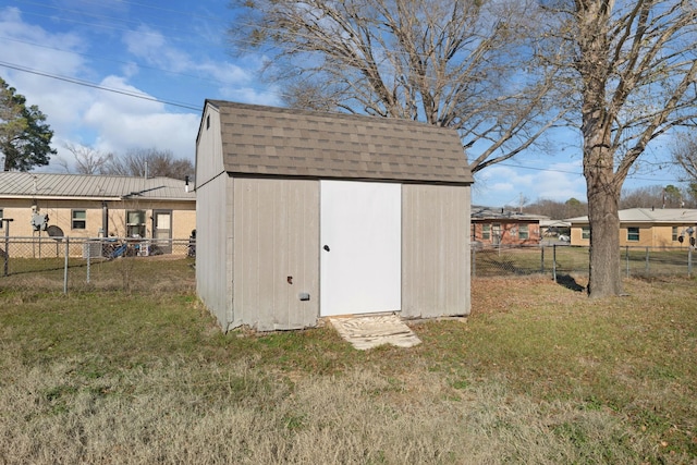 view of outbuilding featuring a lawn