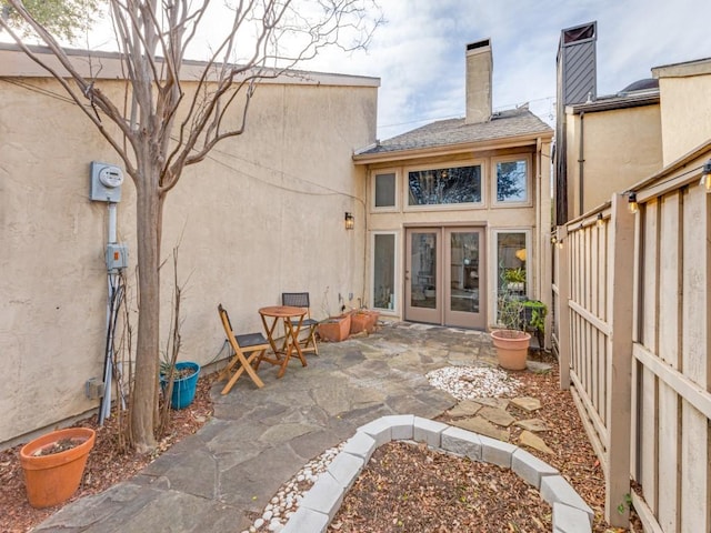 back of property with french doors and a patio