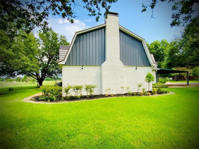 view of property exterior with a yard and a carport