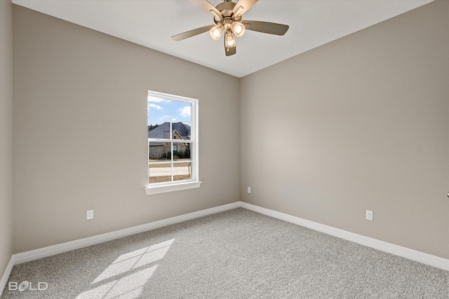 unfurnished room featuring ceiling fan, carpet flooring, and baseboards