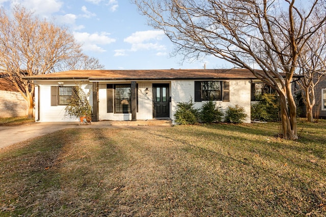 ranch-style home with a front lawn